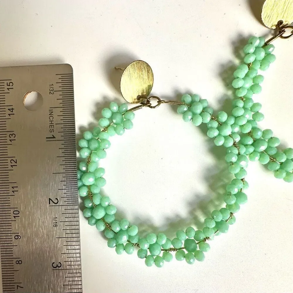Large green floral circle statement earrings